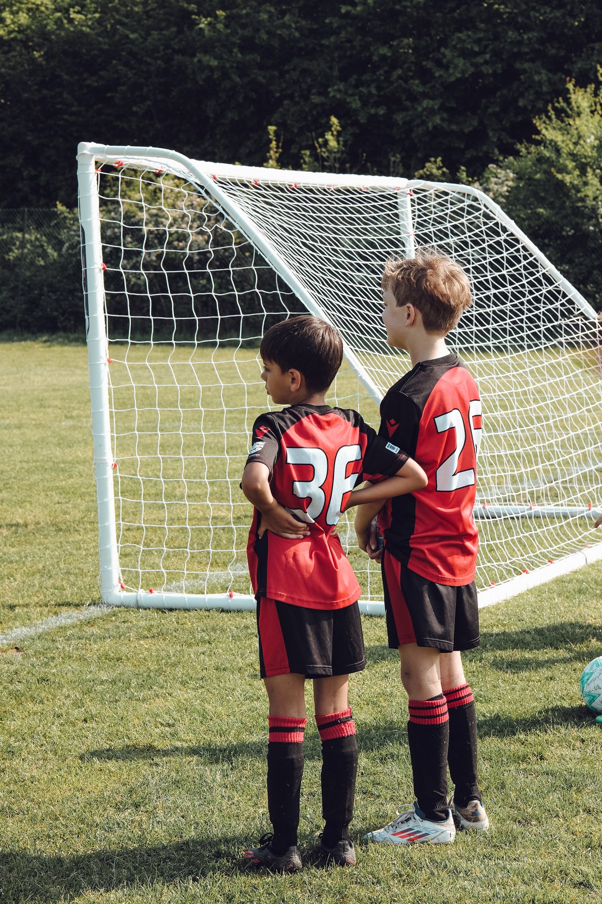Two Horsley FC players standing together beside a goal